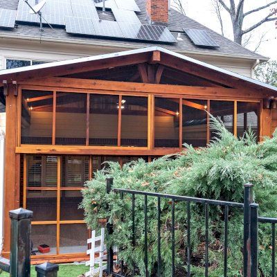 Forever Porch Pavilion (Options: 20' L x 20'-9" W, California Redwood, 2-Post Anchor Kit for High-Wind, No Electrical Wiring Trim, with 2 Fascia Boards for Gutters, 12 ft Posts Height, No Post Decorative Trims, 1 Ceiling Fan Base, No Curtain Rods, with Privacy Panels, Screened Sliding Doors and Fixed Screen Panels, Transparent Premium Sealant). Photo Courtesy of J. Pegg of Cordova, TN.